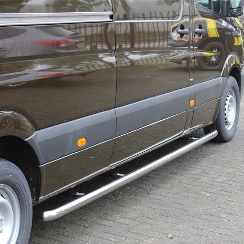 4020005_3_4020005_3.jpeg Dark brown van shown from the side with chrome side steps along the lower body and grey trim panels.